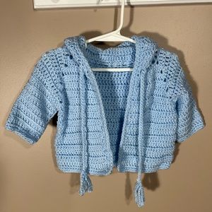 Beautiful baby blue sweater. Hand made by Mom. Fits most 12 - 24 mos.